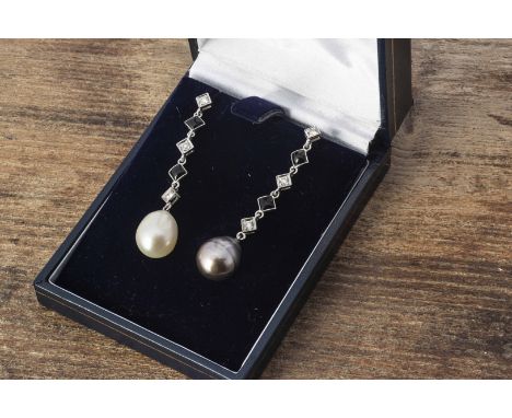 A pair of white metal, diamond, onyx and two coloured pearl ear drops, the lozenge shaped links alternately set with black on