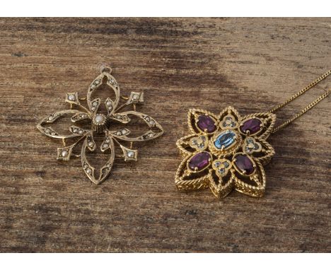 A contemporary QVC gem set star pendant, set with topaz and garnets on a fine gold chain, 2.7 cm by 2.5 cm, together with a 9
