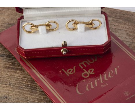 A pair of Cartier 18ct gold cufflinks, the horse bit links marked 750, stamped Cartier in script, no B23846, cased with certi