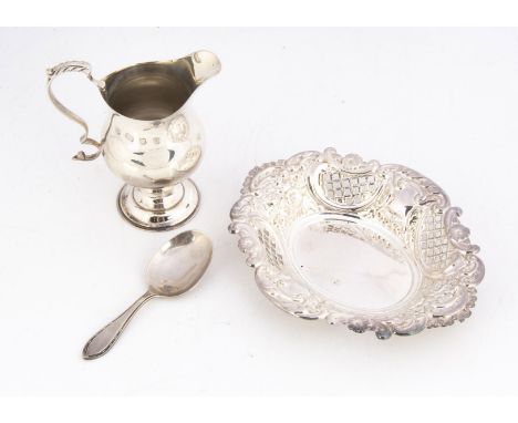 Three second half 20th century items of silver, including a Georgian style cream jug, a bon bon dish and a tea caddy spoon (3
