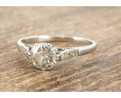 An Art Deco diamond solitaire, the round cut in claw setting with diamond set eight cut shoulders, ring size K, diamond weigh