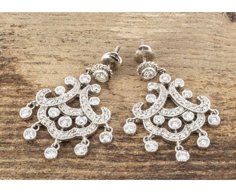 A pair of diamond and white metal chandelier earrings, of openwork swag design, 3.7cm x 2.9cm, approximate 1ct per earring, p