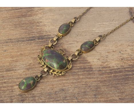 An Arts and Crafts base metal and simulated opal necklace, the gilt wire work with central oval cabochon with leaf surround s