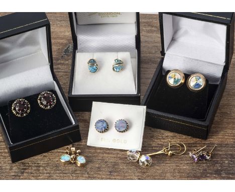 A collection of gem set earrings, including synthetic drop earrings, a pair of opal doublet 9ct gold ear studs, an oval blue 
