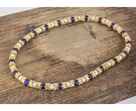A mid Century 18ct gold lapis and pearl choker, the textured gold collars alternately set with lapis lazuli beads and culture