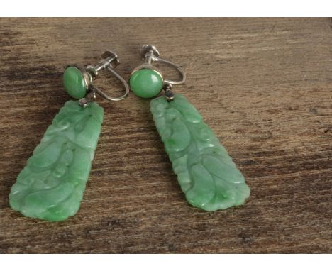 A pair of Chinese jadeite jade white metal mounted screw back earrings, the tapered pierced panels carved with fruits, 4.6cm 