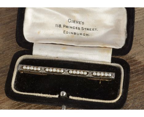 An Art Deco seed pearl and diamond bar brooch, of openwork design, 5.2cm, 2.6g, cased 