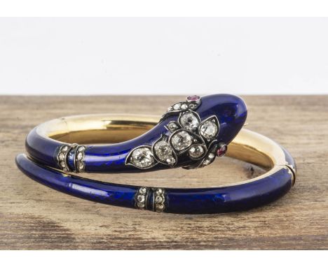 A 19th Century continental blue enamel serpent hinged bangle, with diamond encrusted head and ruby eyes, approximately 1.8ct 