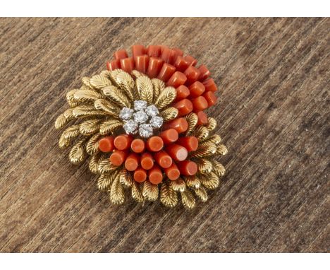 A Cartier gold diamond and coral clip brooch, in the form of a flower, centred with a cluster of brilliant cut diamonds and c