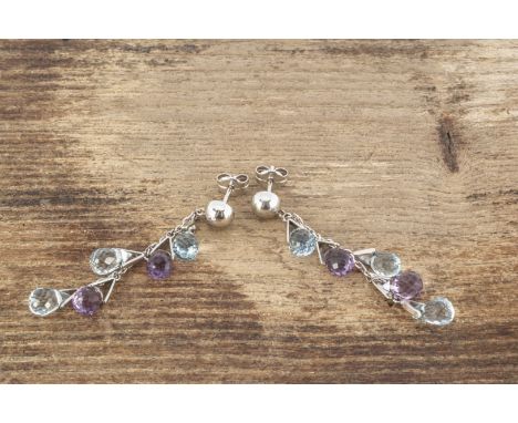 A pair of 18ct white gold chandelier amethyst and topaz ear drops, the faceted pear shaped ear drops on chain links with post