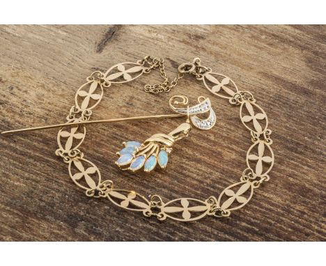 A 9ct gold oval linked bracelet, the oval links with cruciform pierced design, 4.2g together with a 14ct gold opal pendant an