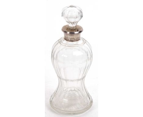 A George VI glass silver decanter, the cut glass body of waisted form having a hallmarked silver collar, Birmingham 1938, mak