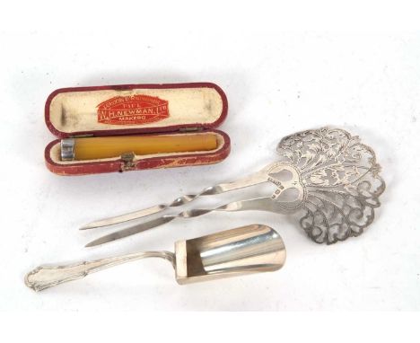 Mixed Lot: An Edwardian silver hair comb, the crown intricately pierced and engraved, with two twisted prongs, hallmarked Bir