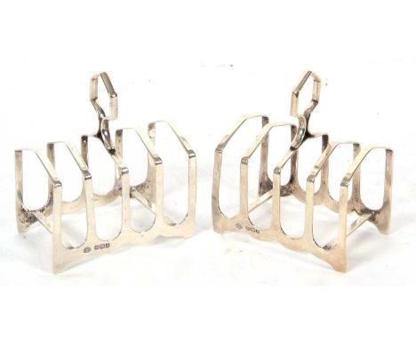 Pair of Art Deco silver toast racks of angular form having four divisions and a central carrying loop handle, Sheffield 1936,