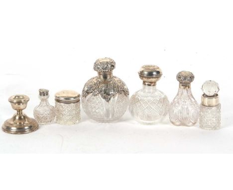 Mixed Lot: An Edwardian cut glass globular scent bottle having a plain silver collar and cherub decorated silver mounted shou