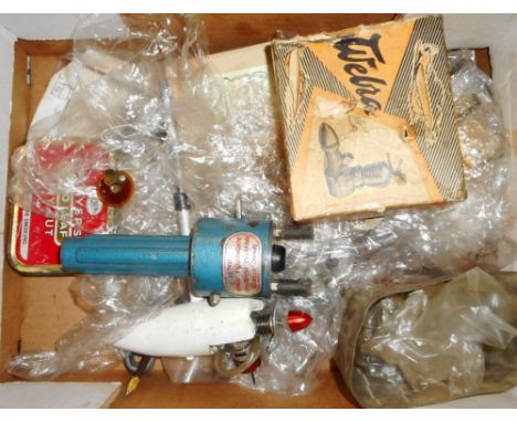Box of various model aircraft related engine spares, some spark plugs, spring starter etc.