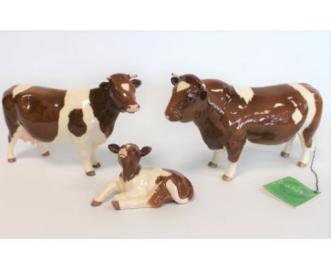 Three Beswick Collectors Club figures: Red Friesian Bull, no. 1439C, 12.1cm high; Red Friesian Cow, no. 1362B, 11.9cm high an