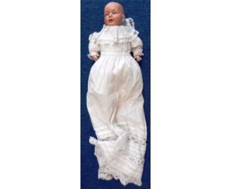Eisenmann bisque headed doll. Marked Einco. 1½. Germany. Damaged finger. Circa 1912. 32cm long.