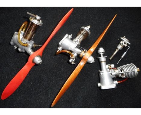 Model aircraft diesel engine. Model 175 &amp; 100 single stroke engines. Circa 1946. Both with 22.5cm propellers. Another 175