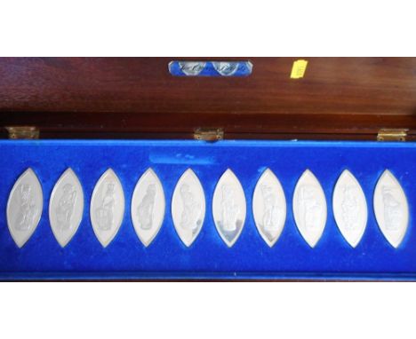 Cased set of ten oval silver ingots 'The Queen's Beasts'. In wooden presentation case. Condition Report. Each ingot 48.1gm
