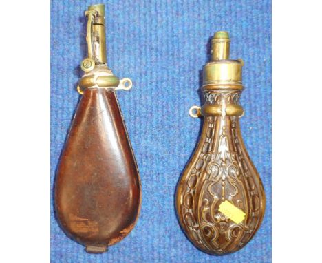 Copper and brass powder flask with embossed decoration., by Hawksley. 8ins. overall. Also leather shot flask. 9½ins overall.