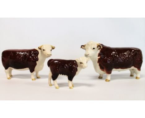 Three Beswick figures: Hereford Bull, 1st version, no. 1363A, 10.8cm high; Hereford Cow, no. 1360, 10.8cm high and Hereford C