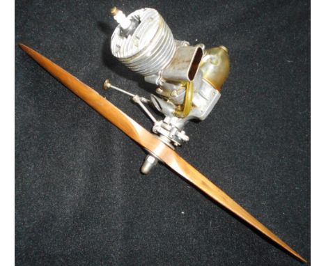 Model aircraft diesel engine. A.I.C. Super Cyclone 10cc single stroke engine. Circa early ‘50s. With Top Flite wooden 31cm pr