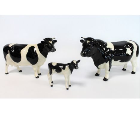 Three Beswick figures: Friesian Bull Ch. "Coddington Hilt Bar", no. 1439A, 12cm high; Friesian Cow Ch. "Claybury Leegwater", 