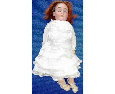 German made bisque headed doll. Make illegible. Individual teeth. 50cm long.