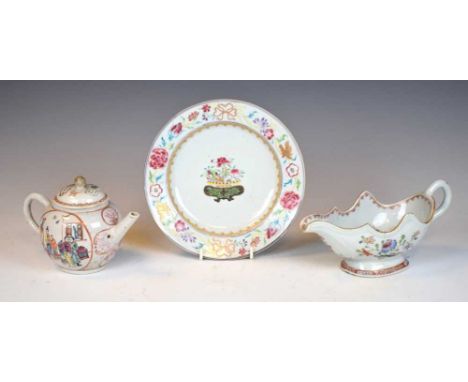 Three pieces of 18th century Chinese Famille Rose porcelain, comprising a bullet shaped teapot and cover, painted with reserv