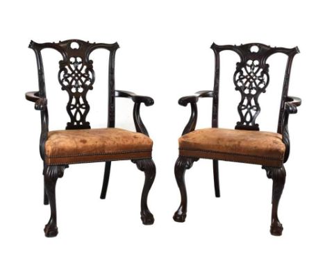 Pair of late 19th or early 20th Century Chippendale Revival elbow chairs or 'carvers', oval plaque beneath seat rail of 'S. &