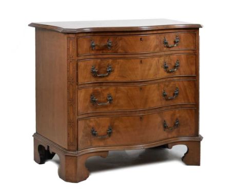 Early 20th Century mahogany Chippendale Revival serpentine chest of drawers, the four graduated long drawers with cast handle