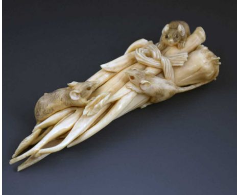 Japanese Meiji period ivory okimono, circa 1900, finely modelled with three rats at a tied bundle of vegetable stalks, one ra