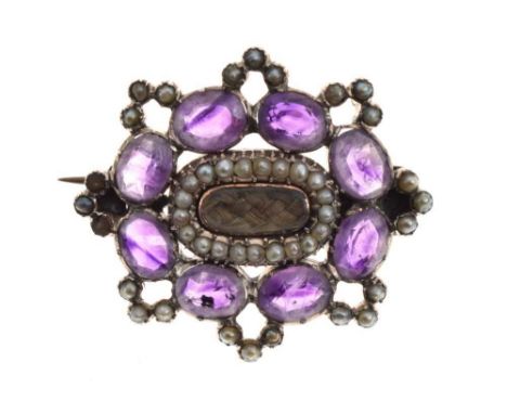 Victorian amethyst and seed pearl mourning brooch, with central glazed hair panel, 3.4cm acrossCondition report: General cond