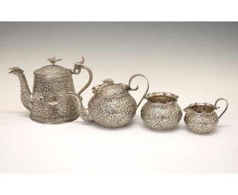 Late 19th Century Colonial Indian white metal matched four-piece teaset in the Kutch manner with all over decoration of flowe