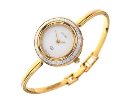 Gucci - Lady's bangle style wristwatch, with thirteen interchangeable bezels, cased and with paperworkCondition report: Gener