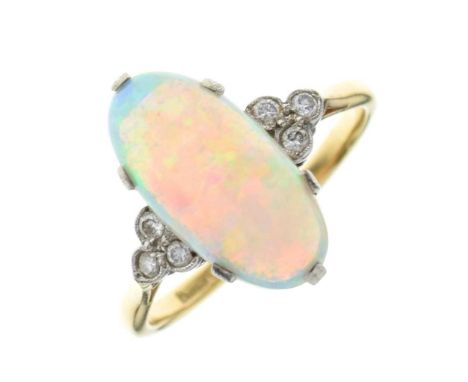 Opal and diamond ring, stamped '18ct' and 'Plat', the long oval cabochon 17.4mm x 8.7mm x 4.7mm deep, with a trio of small di