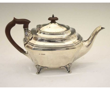 George V silver teapot of shaped rectangular form standing on four cast feet, sponsors mark of John Deakin &amp; Sons., Sheff