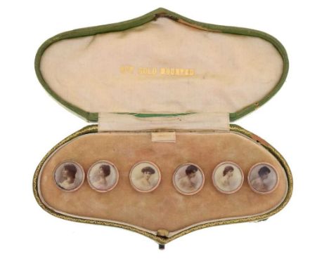 Cased set of yellow metal portrait buttons, mounted with sepia photographic images of Edwardian ladies, in shaped Art Nouveau