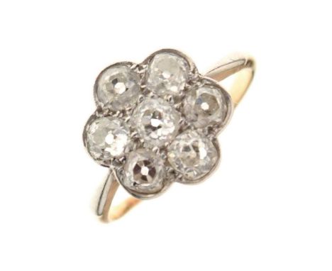 Seven stone diamond cluster ring, indistinct marks, the old brilliant cuts totalling approx 1.1cts estimated, size L, 2.5g gr