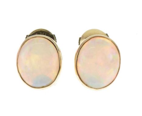 Pair of single stone opal ear studs, unmarked, the shallow cabochons approx 11.5mm long, 3g grossCondition report: General co