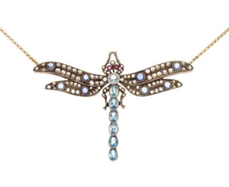 Multi-gem set large dragonfly pendant, unmarked, the thorax and abdomen formed by a line of blue topaz, ruby eyes, rose cut s