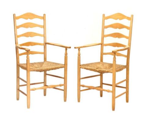 Pair of Neville Neal Arts &amp; Crafts-style rush-seated ash ladder back elbow chairs, mid-20th Century, after a design by Er