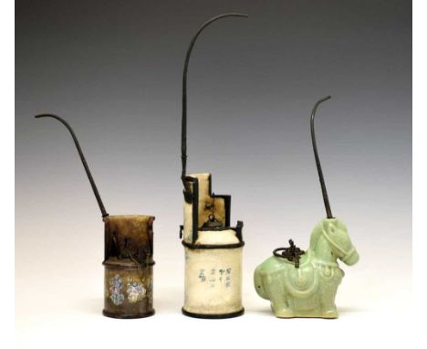 Three Chinese opium stands, the first crackle-glazed with underglaze blue decoration of a fisherman, rows of characters besid