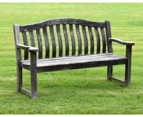 'Alexander Rose' teak garden bench of camel-back design with shaped slatted back between flat outscrolled arms, 156cm wideCon
