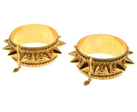 Pair of Eastern hinged bangles, in unmarked yellow metal, of spiked design, 5.6cm inner diameter, 102g grossCondition report: