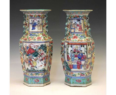 Pair of Chinese Canton Famille Rose hexagonal baluster vases, late 19th Century, each with moulded twin Dog of Fo handles, de