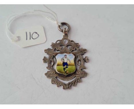 A fancy silver and enamel fob of a footballer 