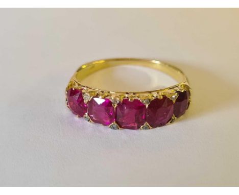 AN VICTORIAN 5 STONE BURMA RUBY RING SET WITH DIAMOND POINTS WITH A CERT FROM THE GEM AND PEARL LAB STATING THAT ALL 5 RUBYS 