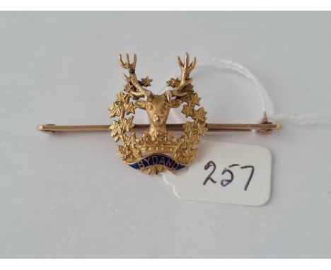 A military brooch with a stag surrounded by foliage with enamel panel BYDAND 9ct - 5.9 gms 